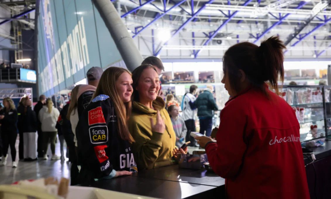 Staff member interacts with customers at The O2 Arena