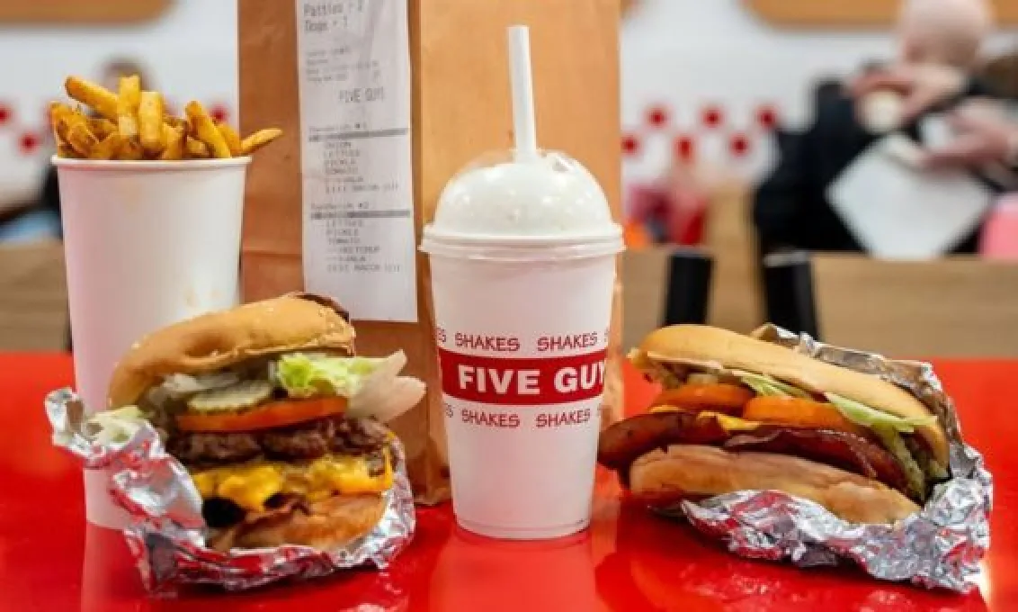 Burgers fries and a large milkshake ready to be enjoyed at Five Guys at The O2 Belfast