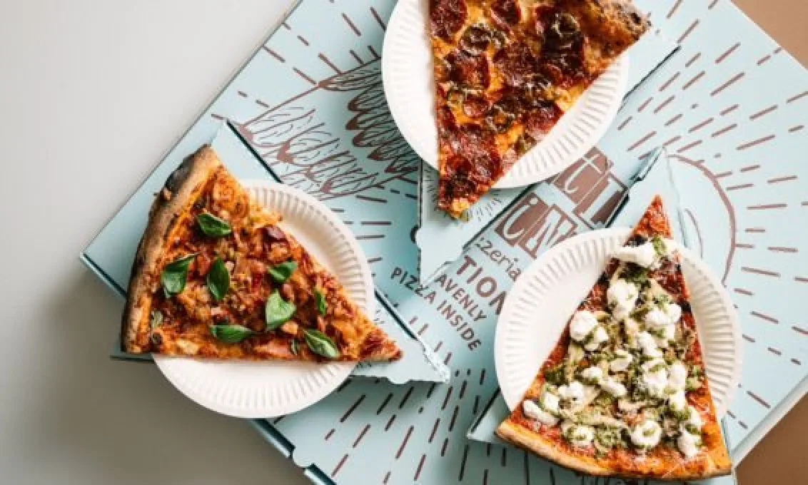 Three large slices of pizza with a selection of toppings from Little Wing Sliced at The O2 Belfast