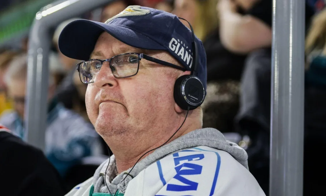 Event-goer wears commentary device for accessibility at The O2 Belfast.