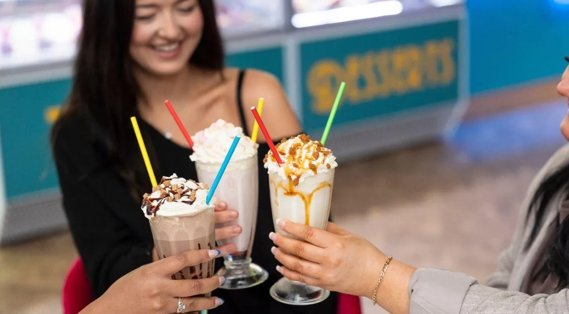 Friends enjoy sundaes at Titanic Desserts at The O2 Belfast