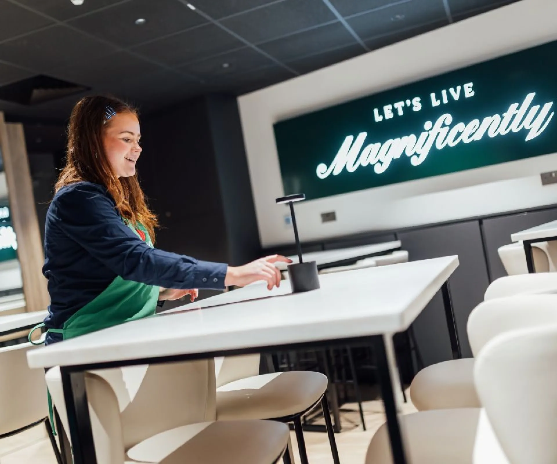 Member of staff working at premium hospitality lounge at the arena