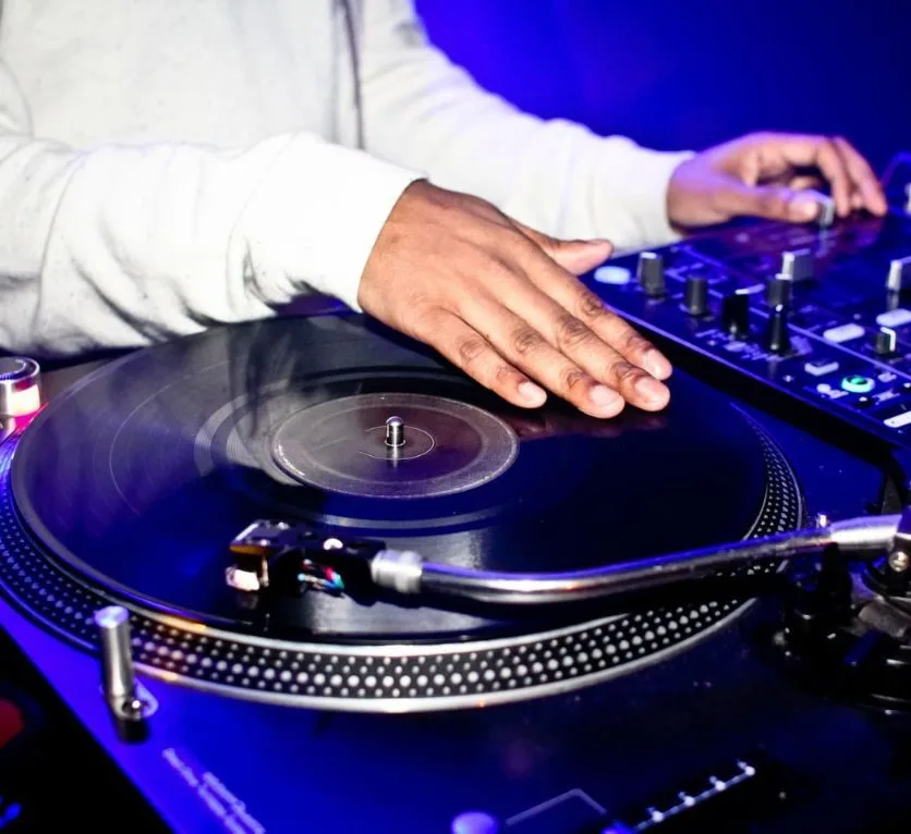 DJ spins decks at a live event